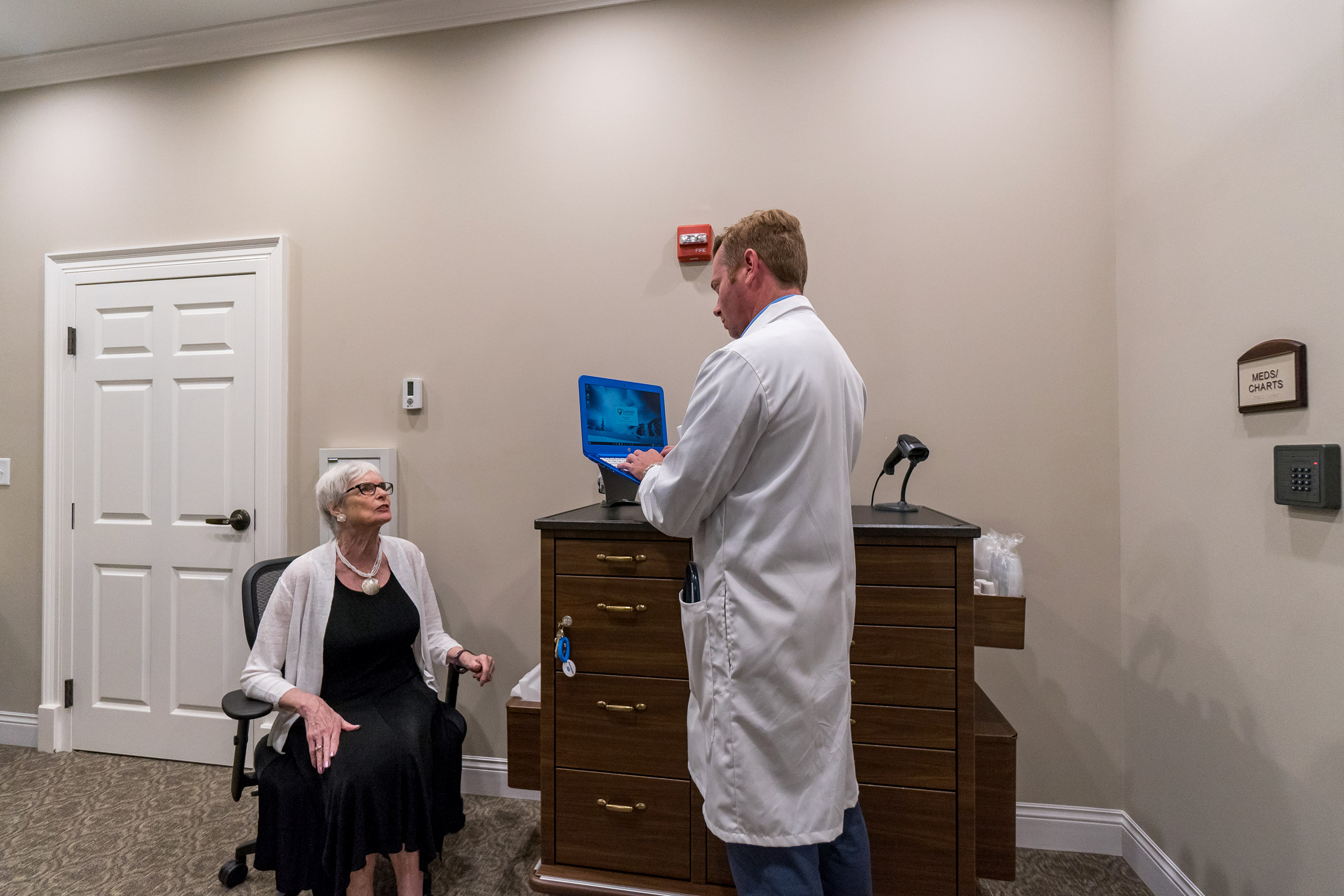 A resident is examined by the doctor in assisted living