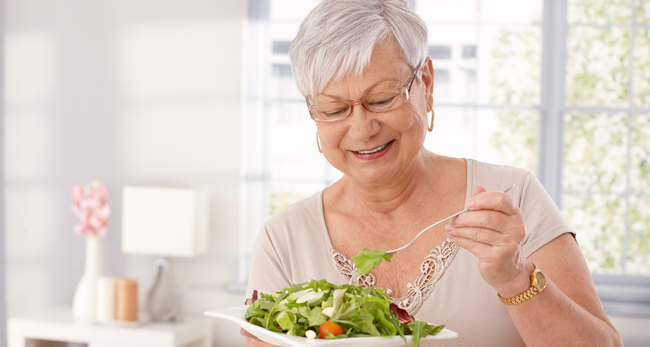 A woman enjoys a healthy salad