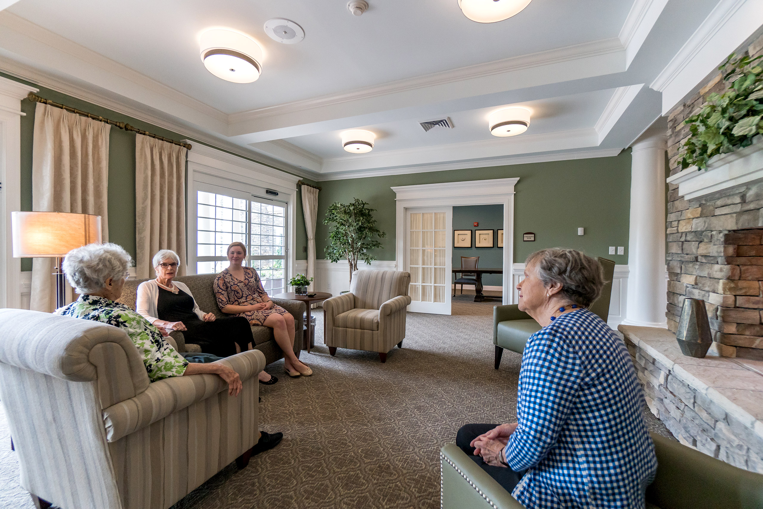 Residents and guests enjoy the fireplace and lounge in Richmond