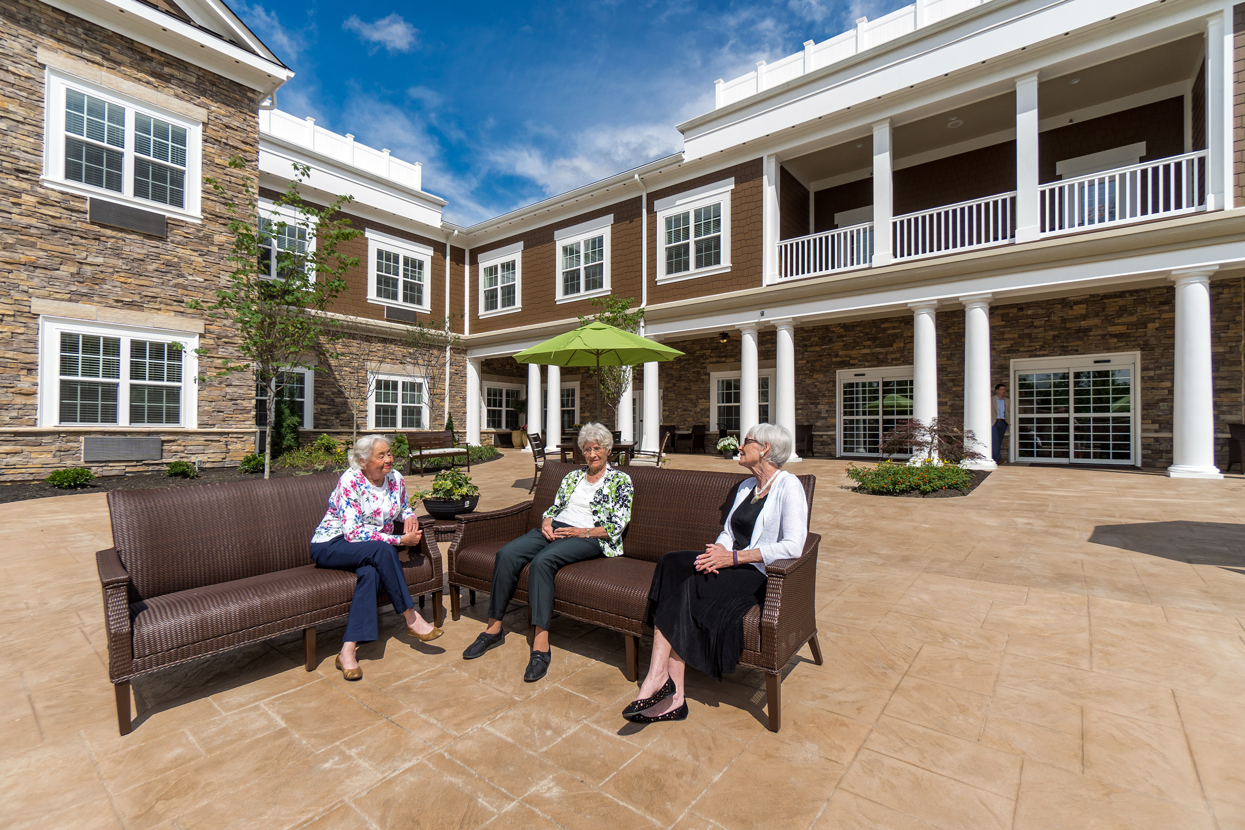 Ladies enjoying a sunny afternoon in Richmond courtyard